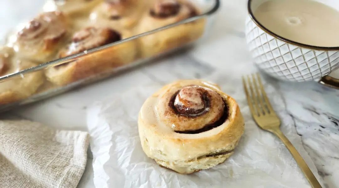 Frosted cinnamon rolls served with coffee