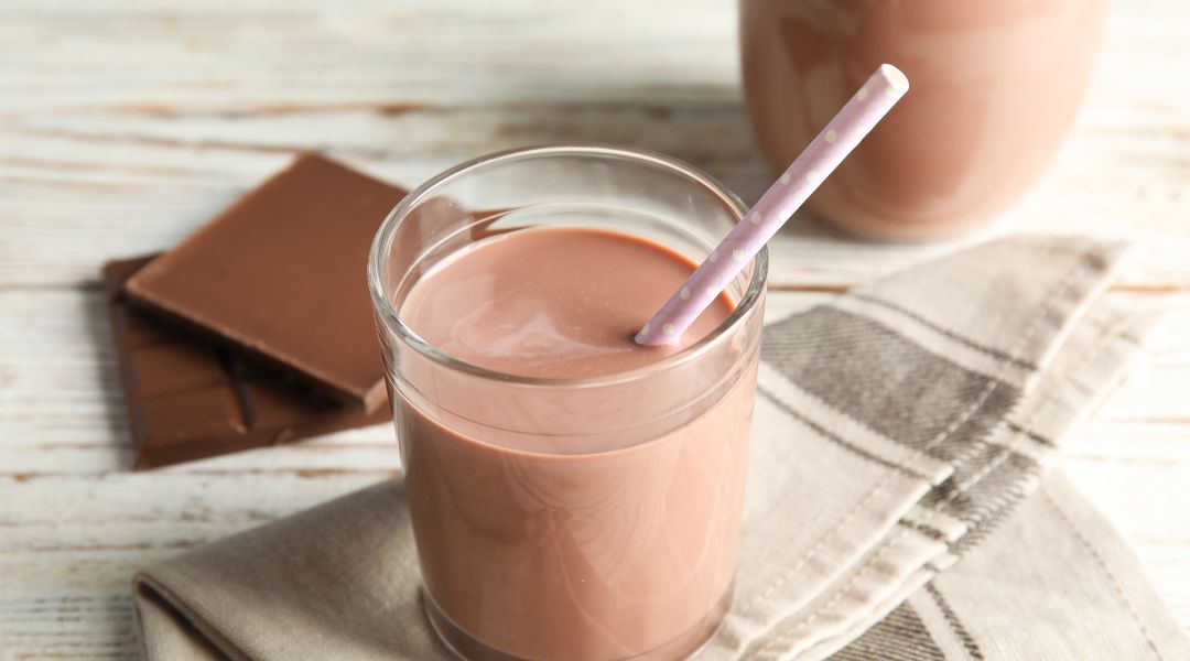 Glass of chocolate milk for recovery after training