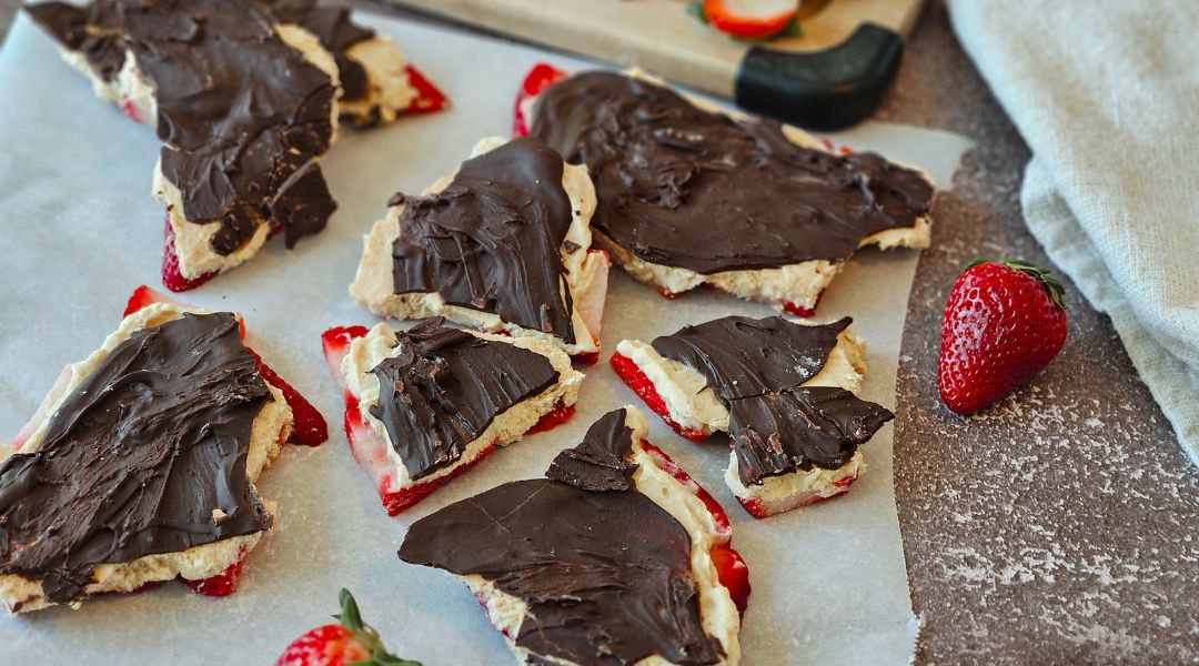 chocolate covered strawberries on a cutting board