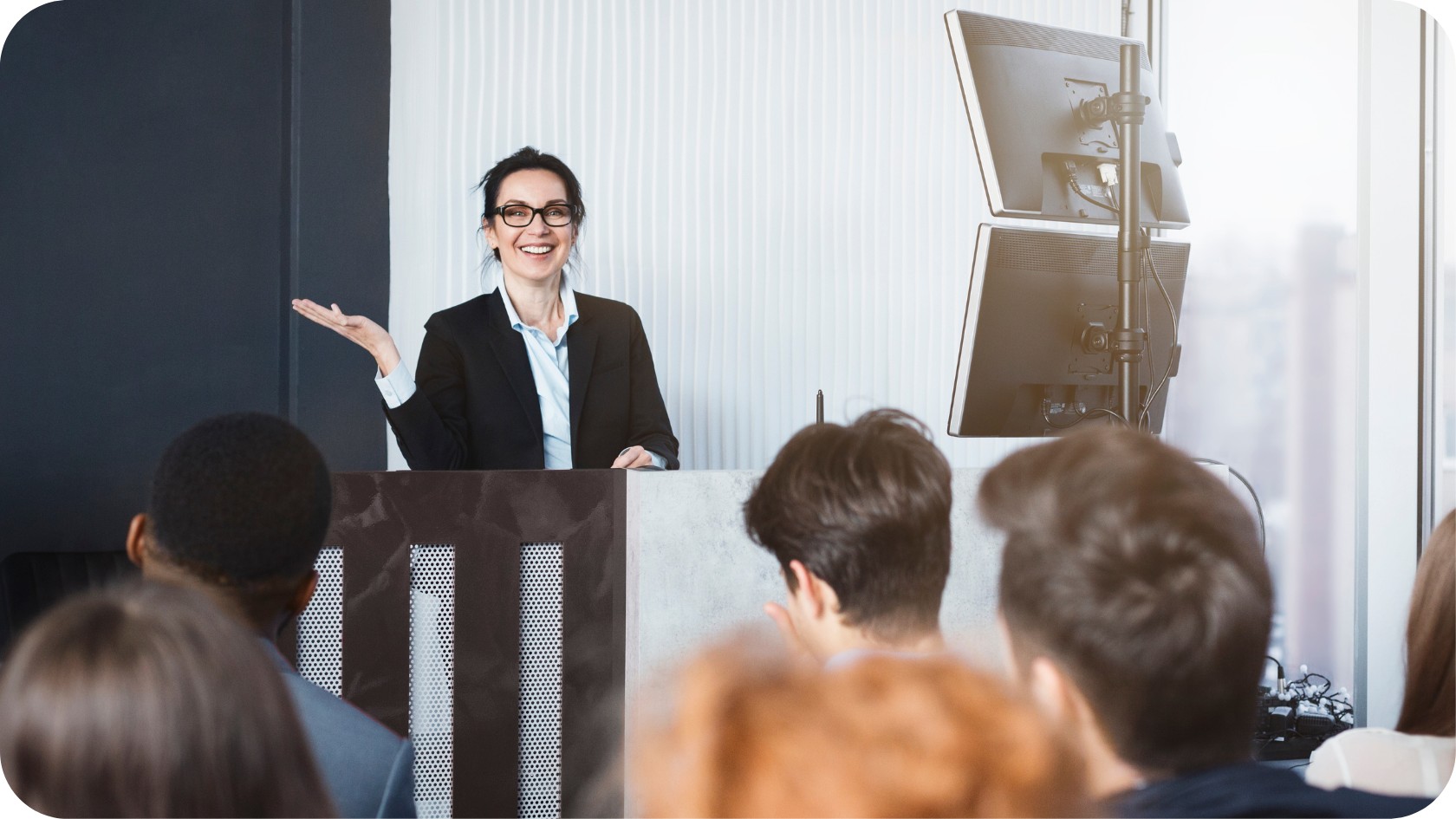 Dietitian giving a presentation to an audience in a conference room