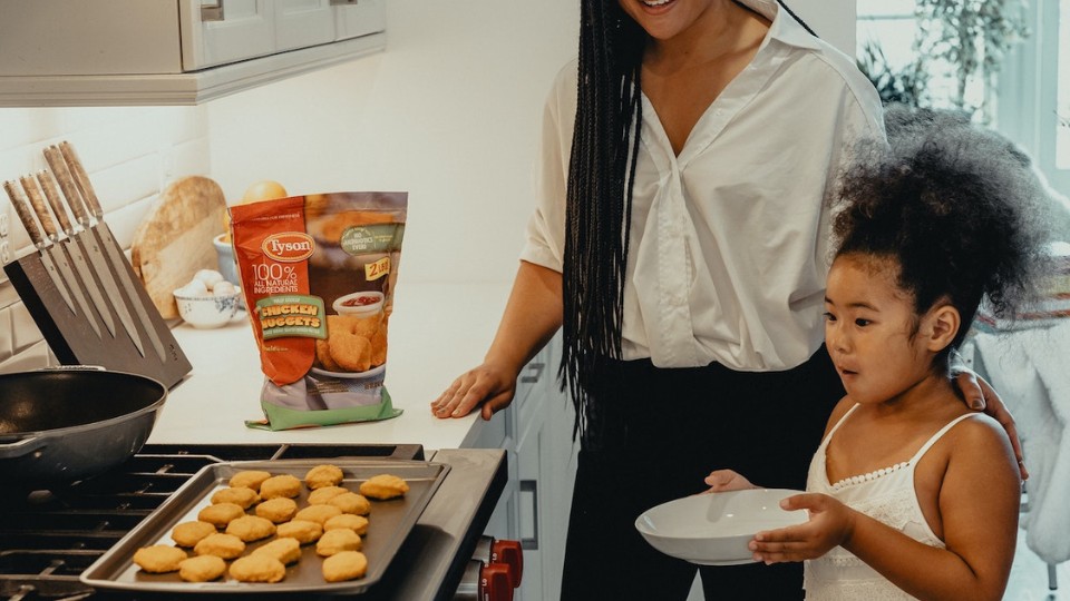 mother and daughter cooking