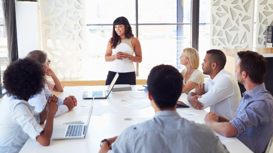 team meeting led by a woman