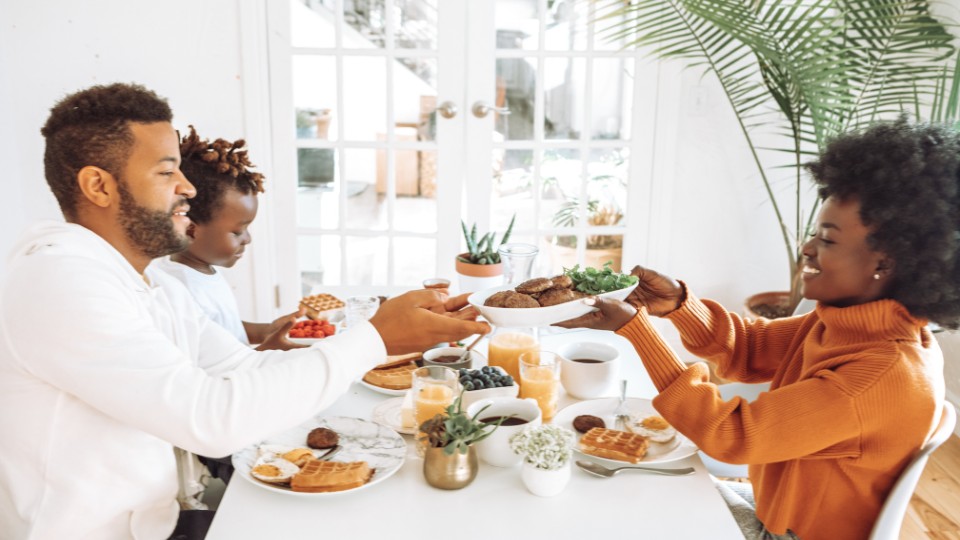 Couple with child sharing breakfast