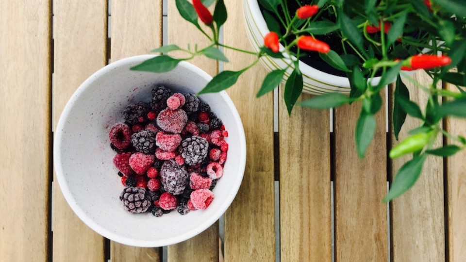 frozen fruit in a bowl with hot pepper