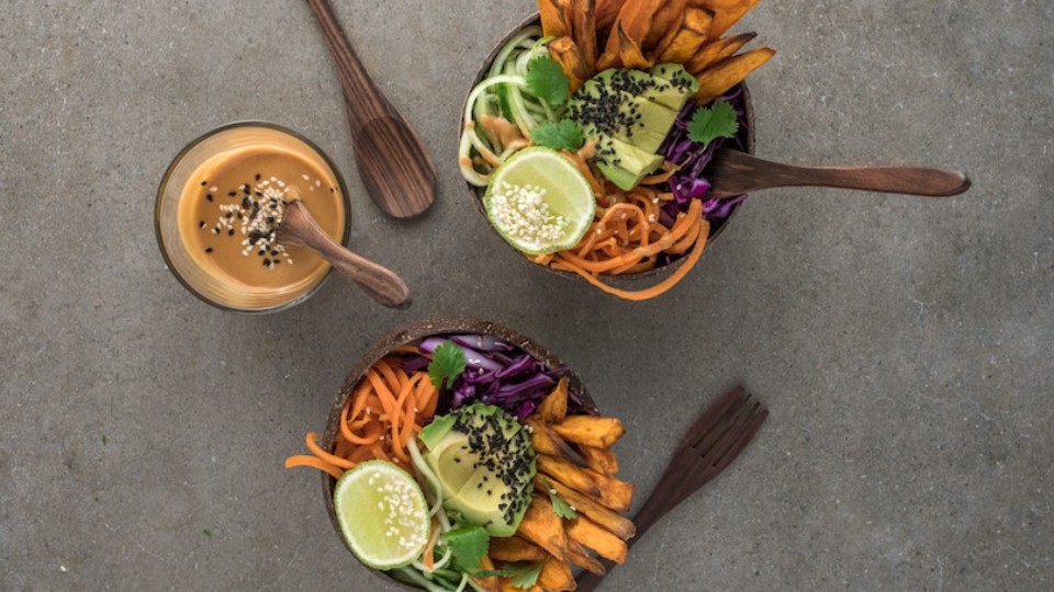 vegetable bowl with avocado and peanut sauce