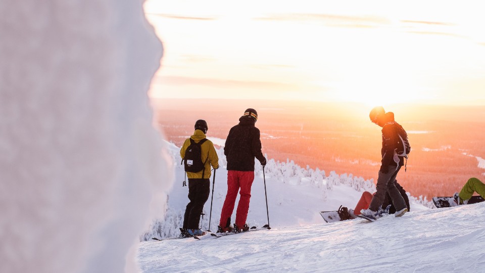adults skiing in the middle of winter on a mountain