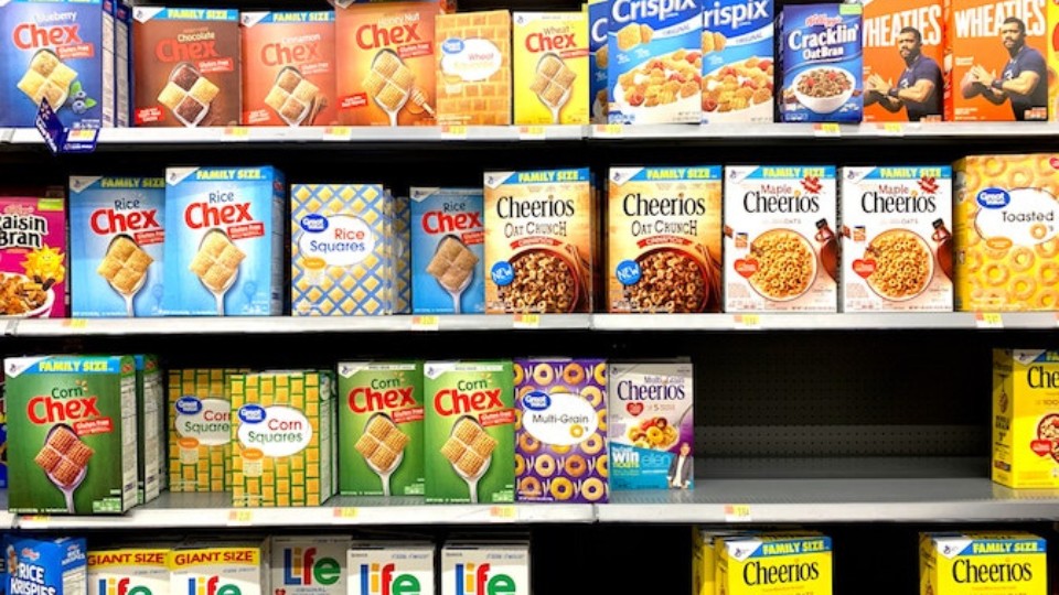 ultra-processed products in a grocery store, cereal boxes