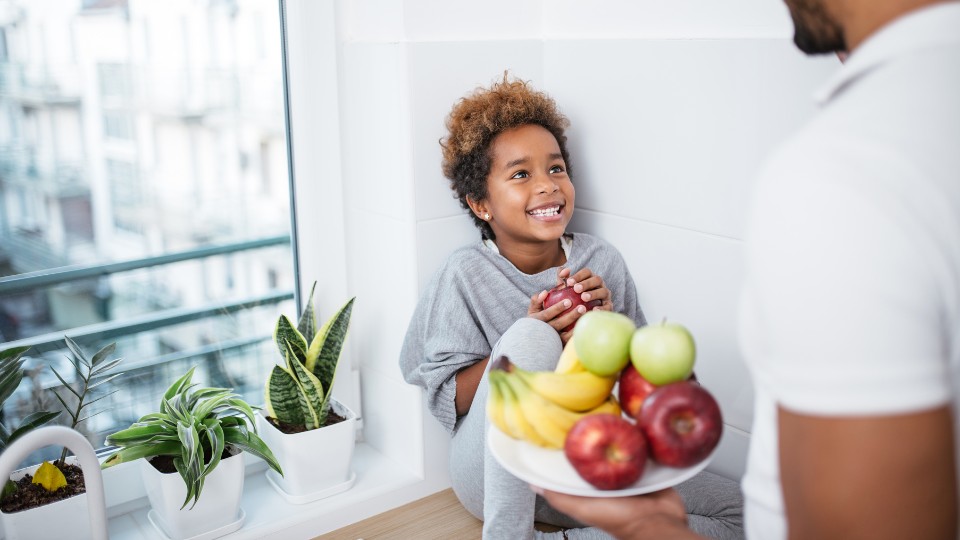 Child receiving a healthy snack