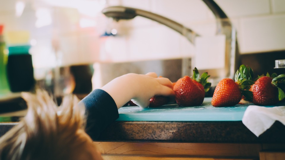 kid and strawberries 