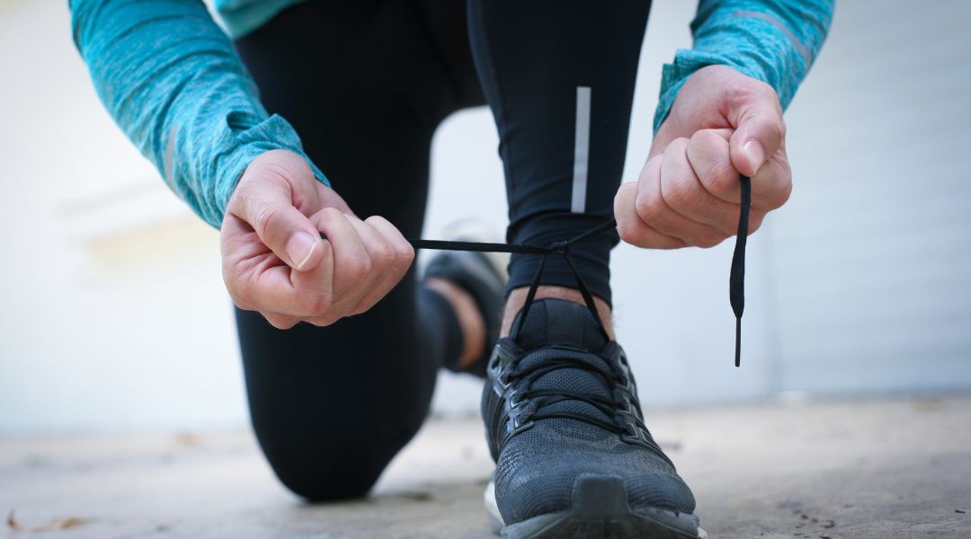 tying running shoes