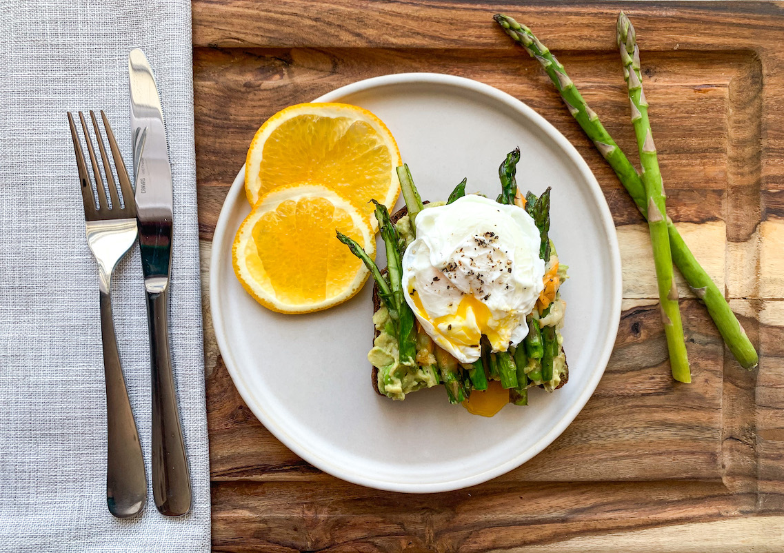 Plate with orange and benedict egg