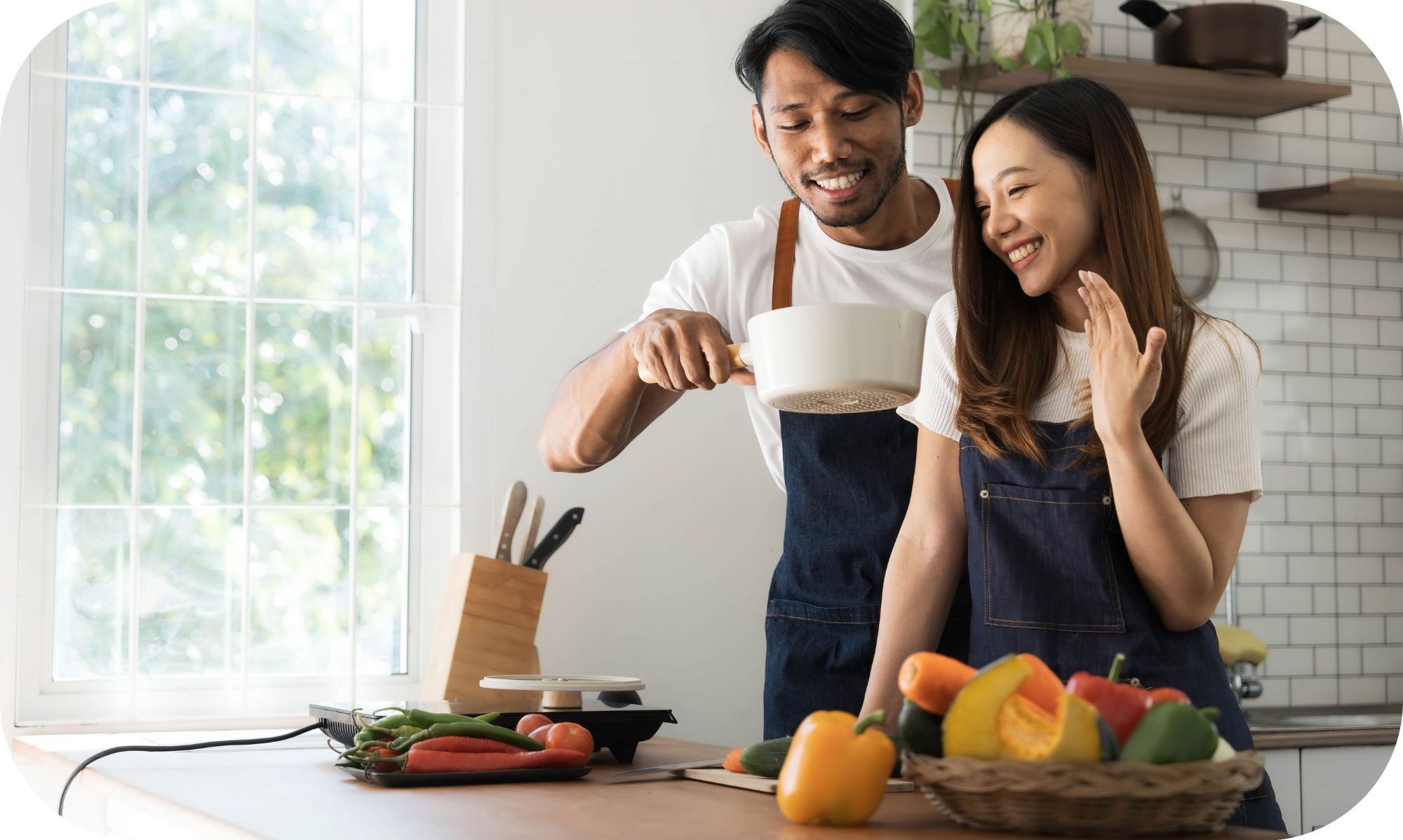 Couple cooking in kitchen