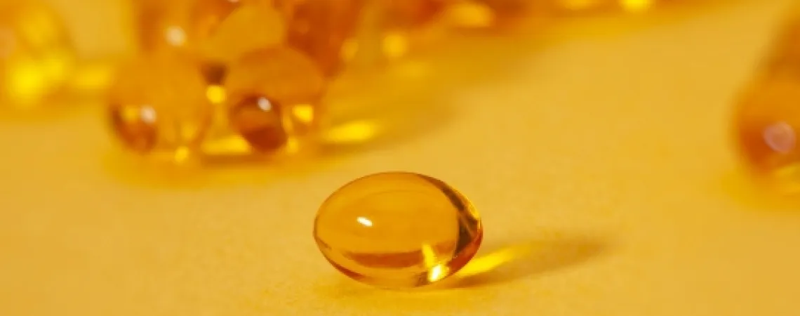 Vitamin on yellow background