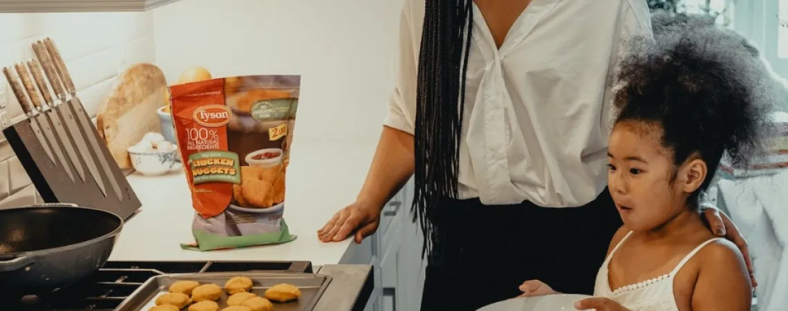 mother and daughter cooking