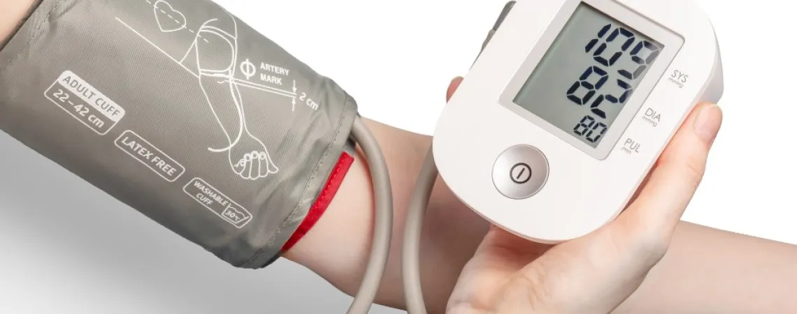 Adult blood pressure monitor in use