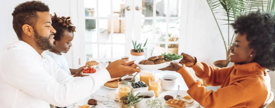 Couple with child sharing breakfast