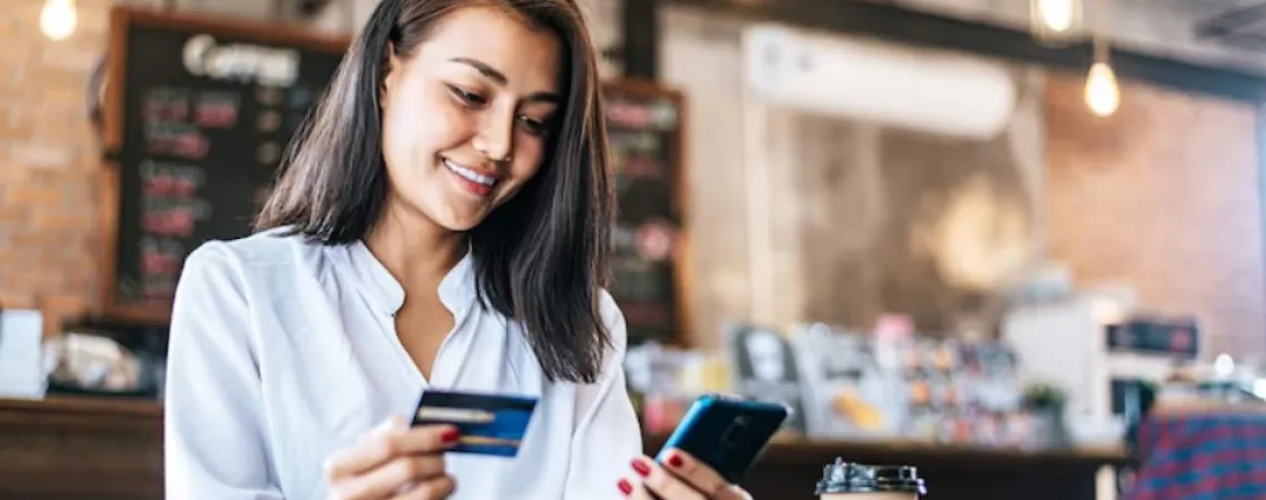 Woman giving her credit card number over the phone to book an appointment with a registered dietitian