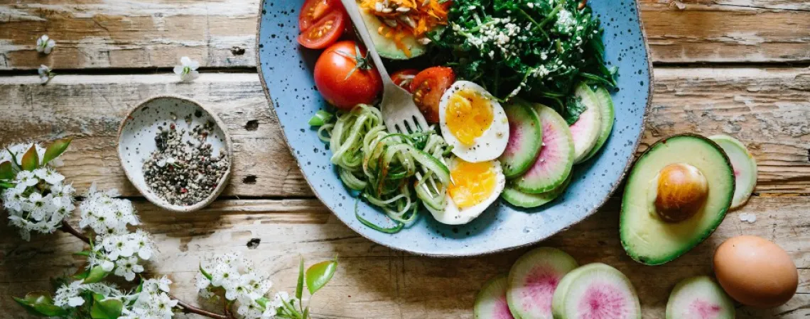 bowl with tomatoes, egg and greens