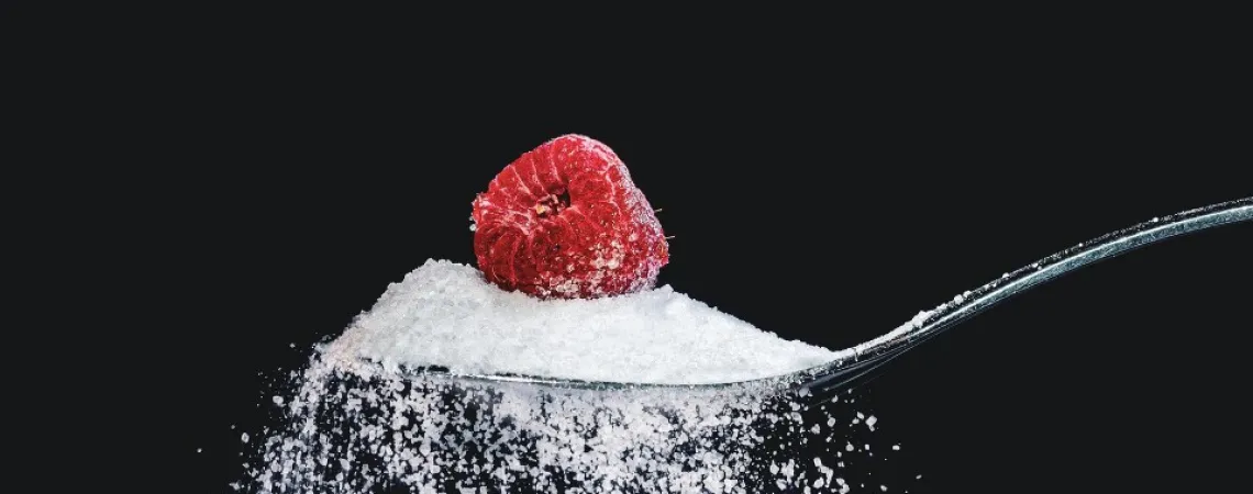 refined sugar with a raspberry