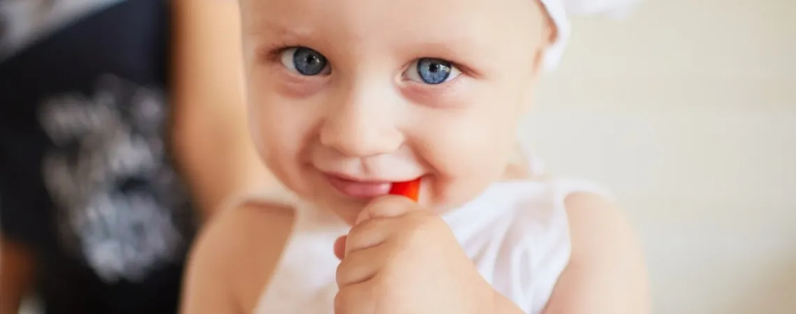 blue-eyed child in a chef's hat