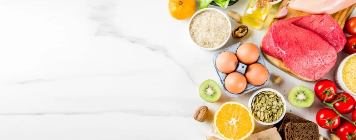 an assortment of healthy foods arranged on a marble surface