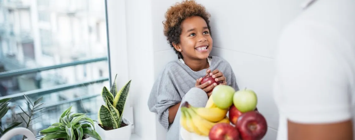 Child receiving a healthy snack