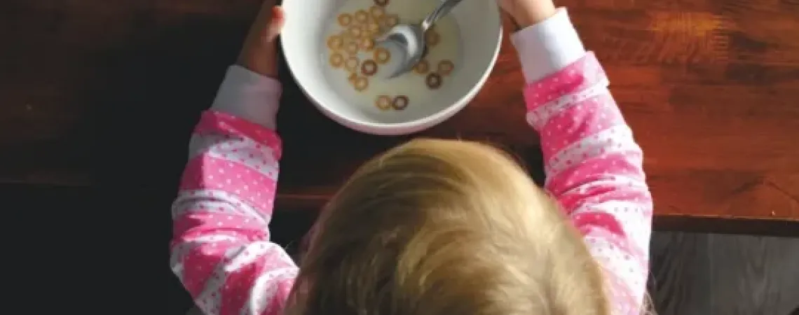 Kid eating cereals