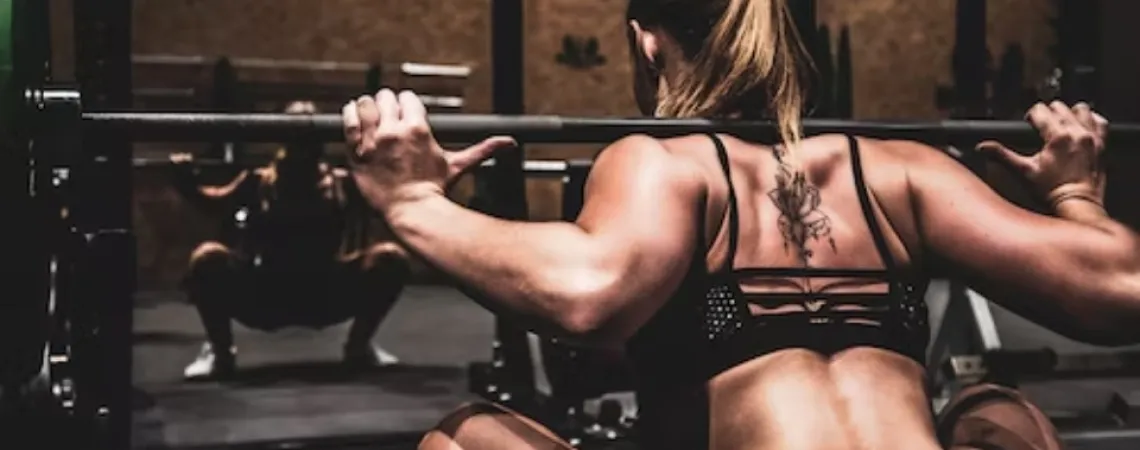 woman lifting weights at the gym