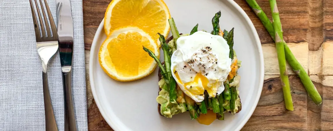 Plate with orange and benedict egg