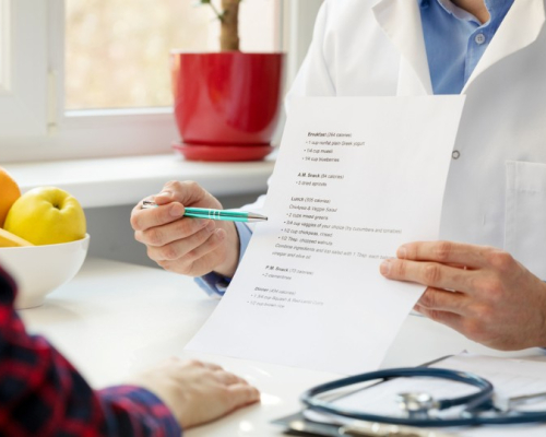 Healthcare professional presenting information to the patient.