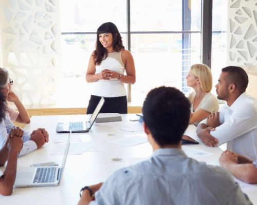 team meeting led by a woman