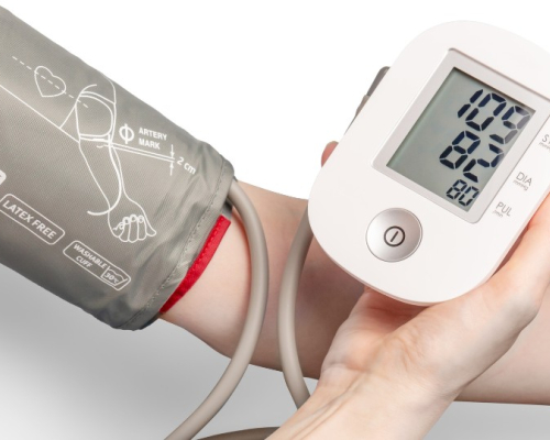 Adult blood pressure monitor in use