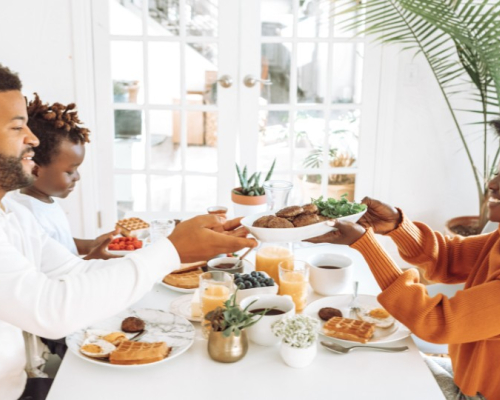 Couple with child sharing breakfast