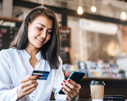 Woman giving her credit card number over the phone to book an appointment with a registered dietitian