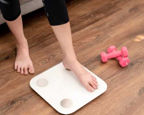 Person stepping on a white scale in a living room with pink dumbbells on the wooden floor nearby.