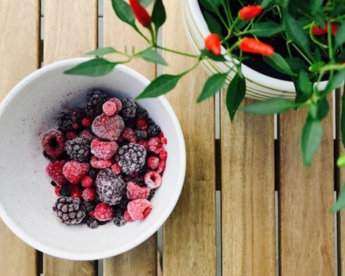 frozen fruit in a bowl with hot pepper