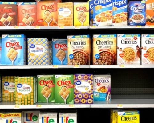 ultra-processed products in a grocery store, cereal boxes