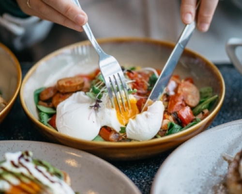 eggs, sausages and vegetables in a bowl