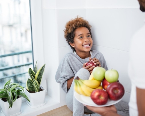 Child receiving a healthy snack