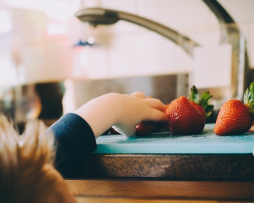 kid and strawberries 