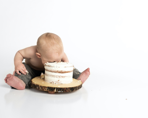 baby eating cake