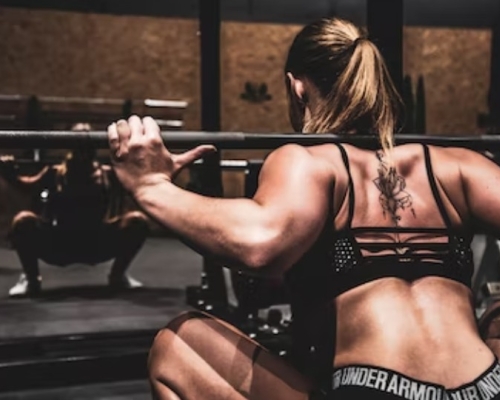 woman lifting weights at the gym