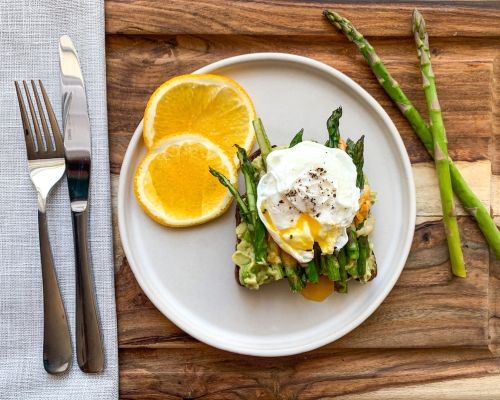 Plate with orange and benedict egg