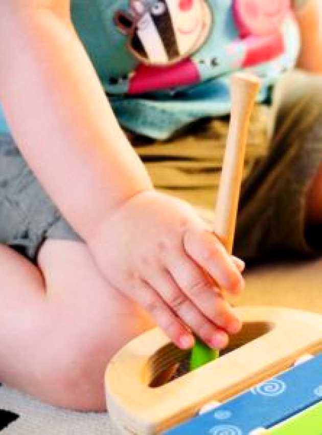 Obese child playing xylophone