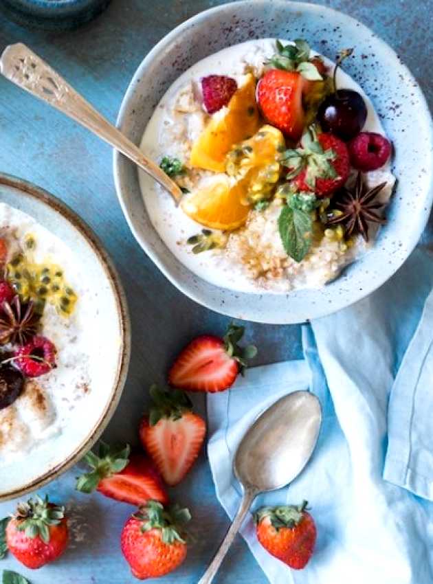 two bowls of oatmeal with fruits