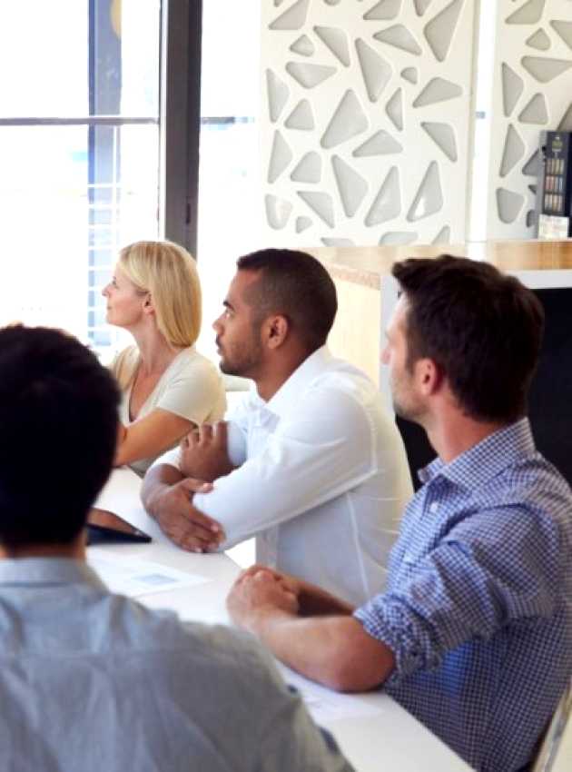 team meeting led by a woman