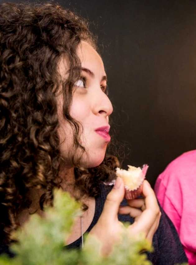 man and woman eating while looking at each other