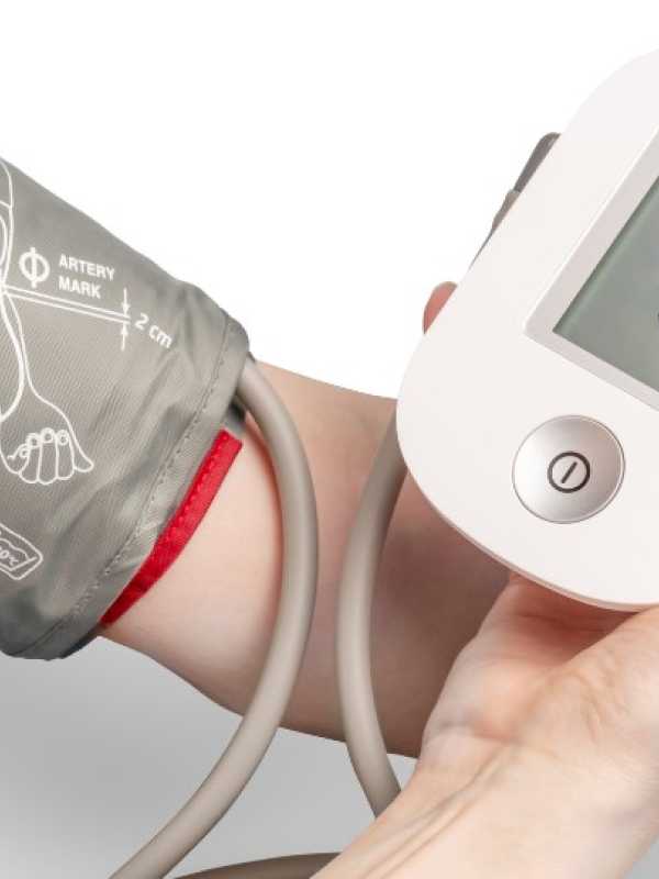 Adult blood pressure monitor in use
