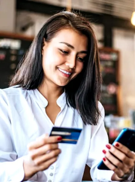 Woman giving her credit card number over the phone to book an appointment with a registered dietitian