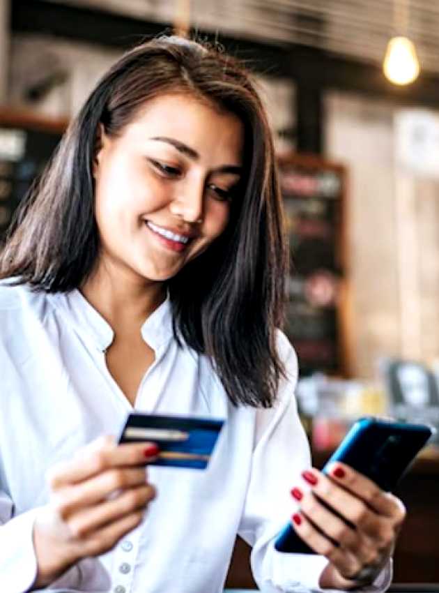 Woman giving her credit card number over the phone to book an appointment with a registered dietitian